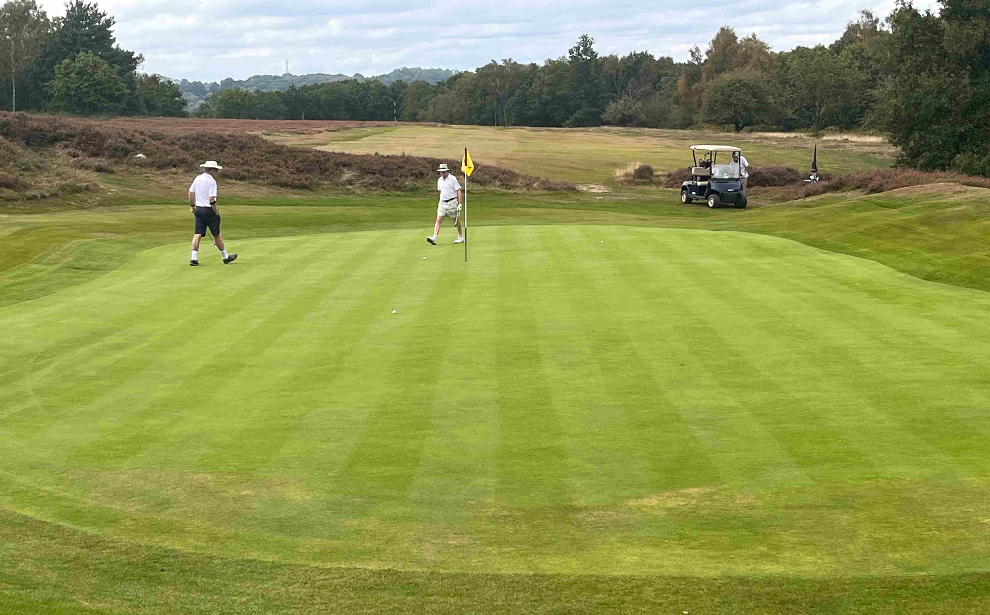 2023 Tour Keith and Anthony survey the 8th green at Royal Ashdown Forest